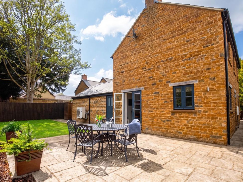 A patio with table and chairs at a property