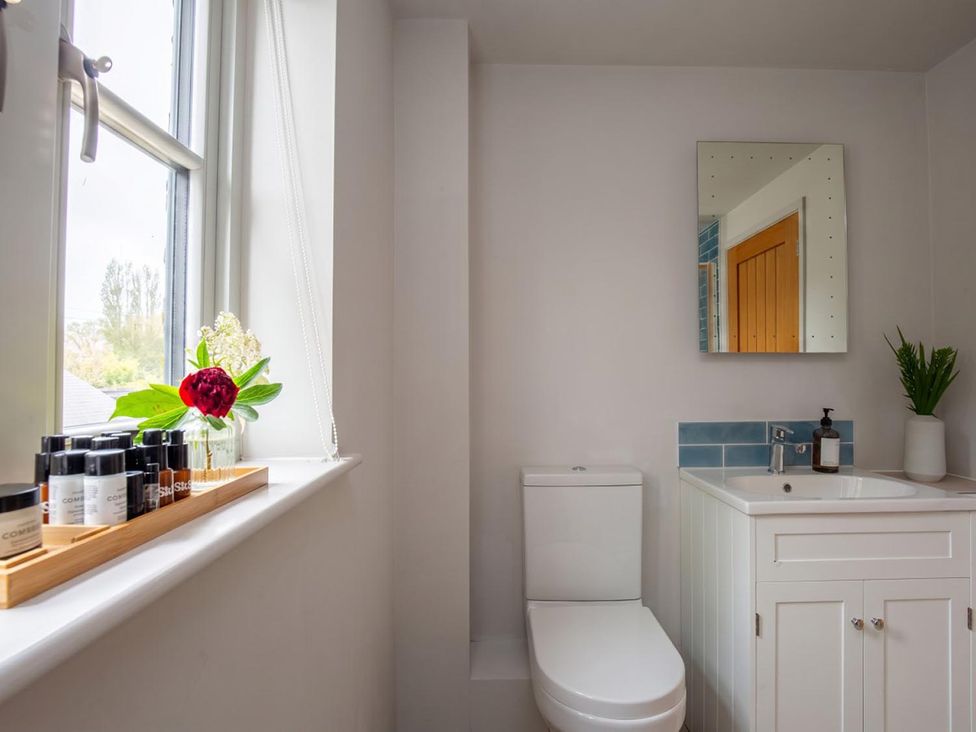A bathroom with a sink and toilet at 