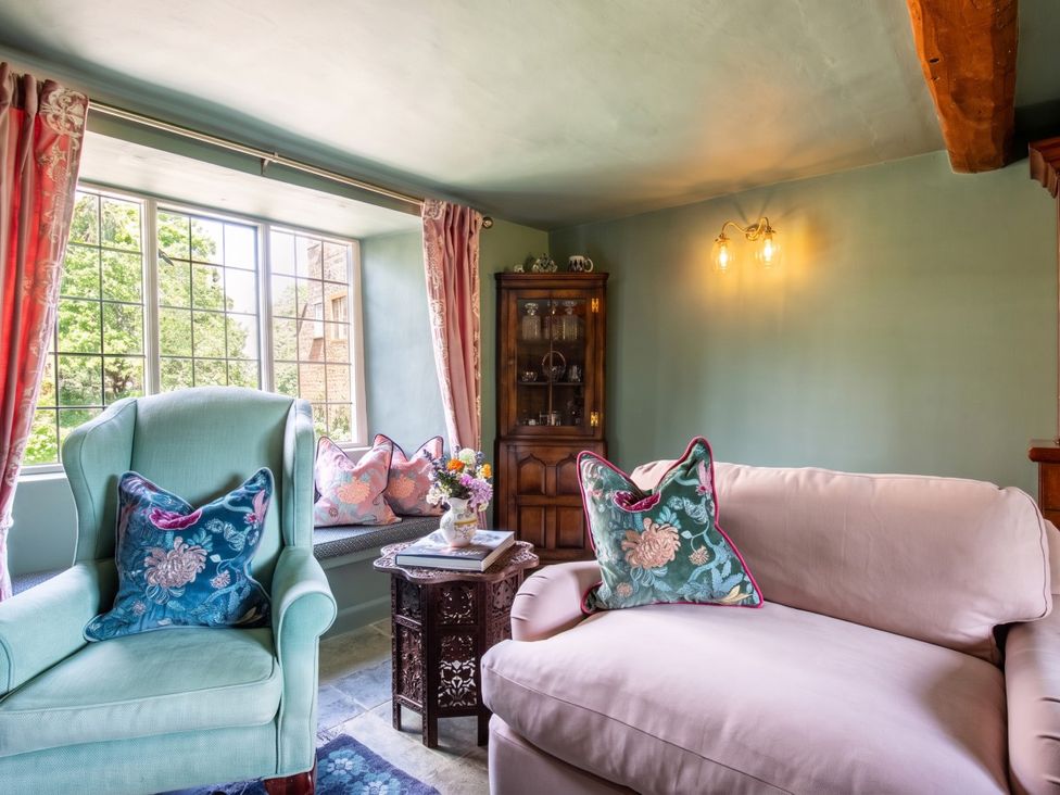 A living room with chairs and a table at an unspecified location