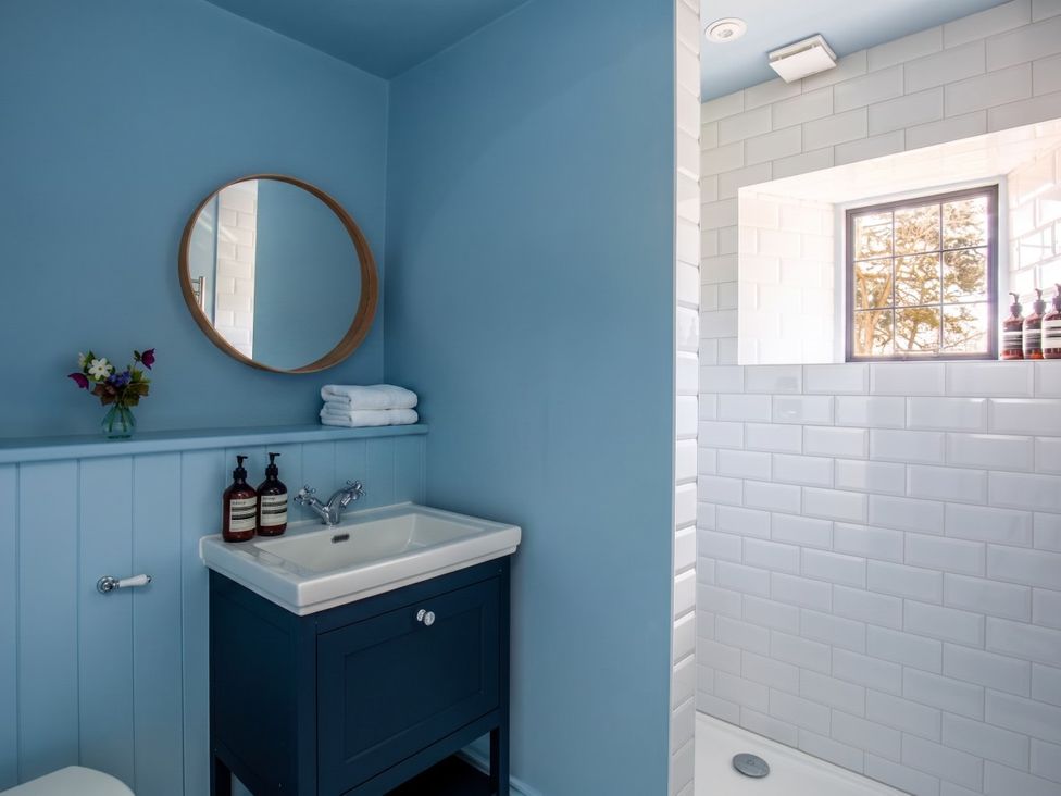 A bathroom with a sink and shower at The Old Barn in Manchester