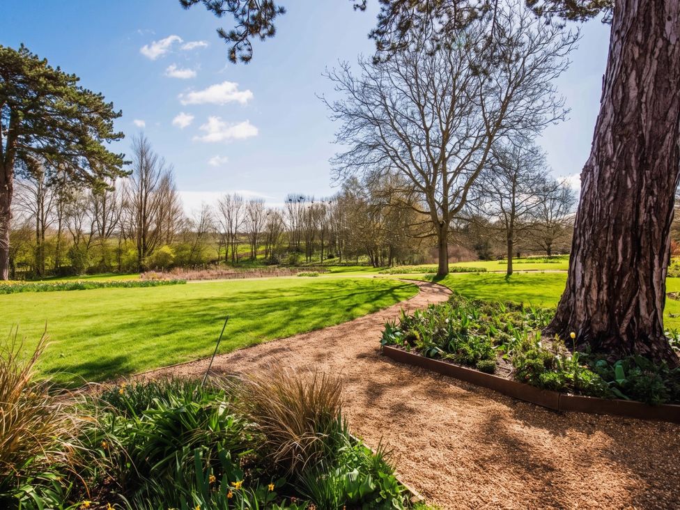 A garden with trees and a path at the property