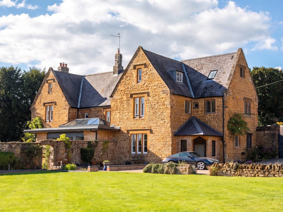 A house with a garden and car at the property