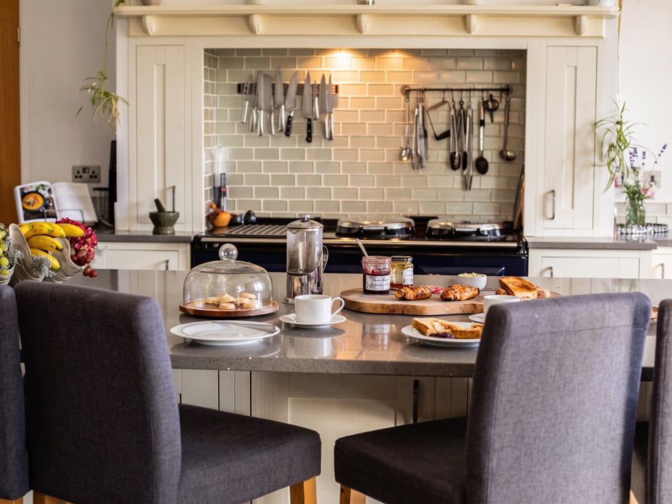 A kitchen countertop with breakfast items at the property