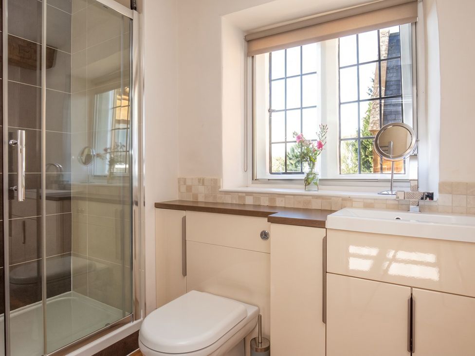 A bathroom with a shower and toilet at The Old Barn in Manchester