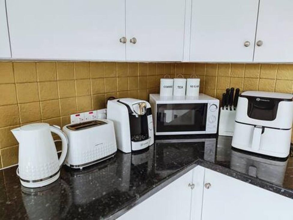 A kitchen countertop with small appliances at a property