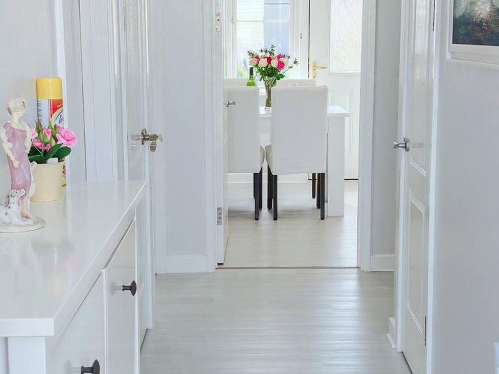 A hallway leading to a dining area at an unspecified property