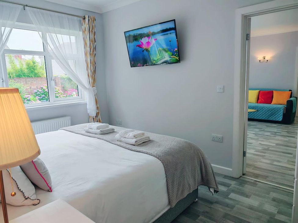 A bedroom with a bed and television at 