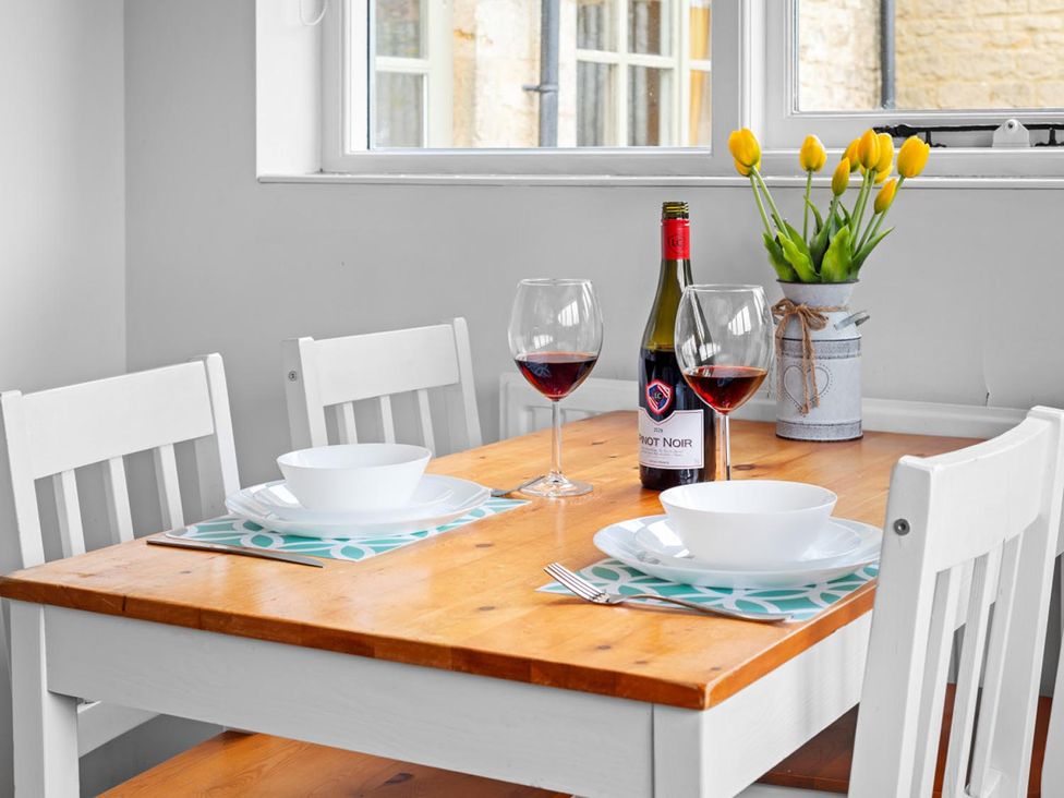 A dining room with a table set for two at The Old Barn in Manchester