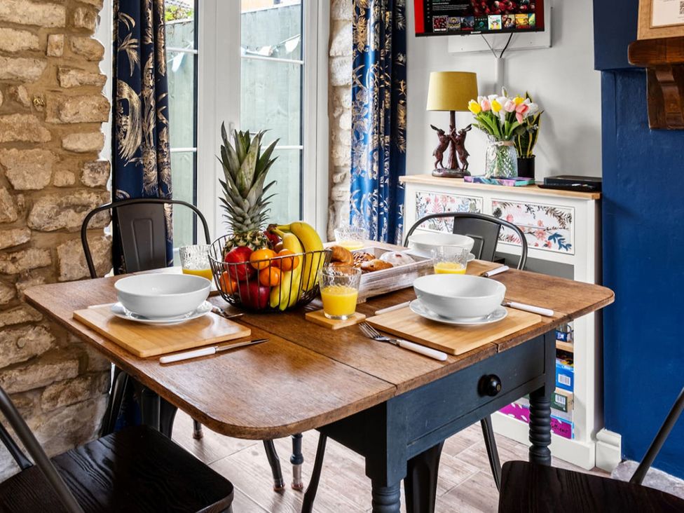 A dining room with a table set for breakfast at The Old Barn in Manchester