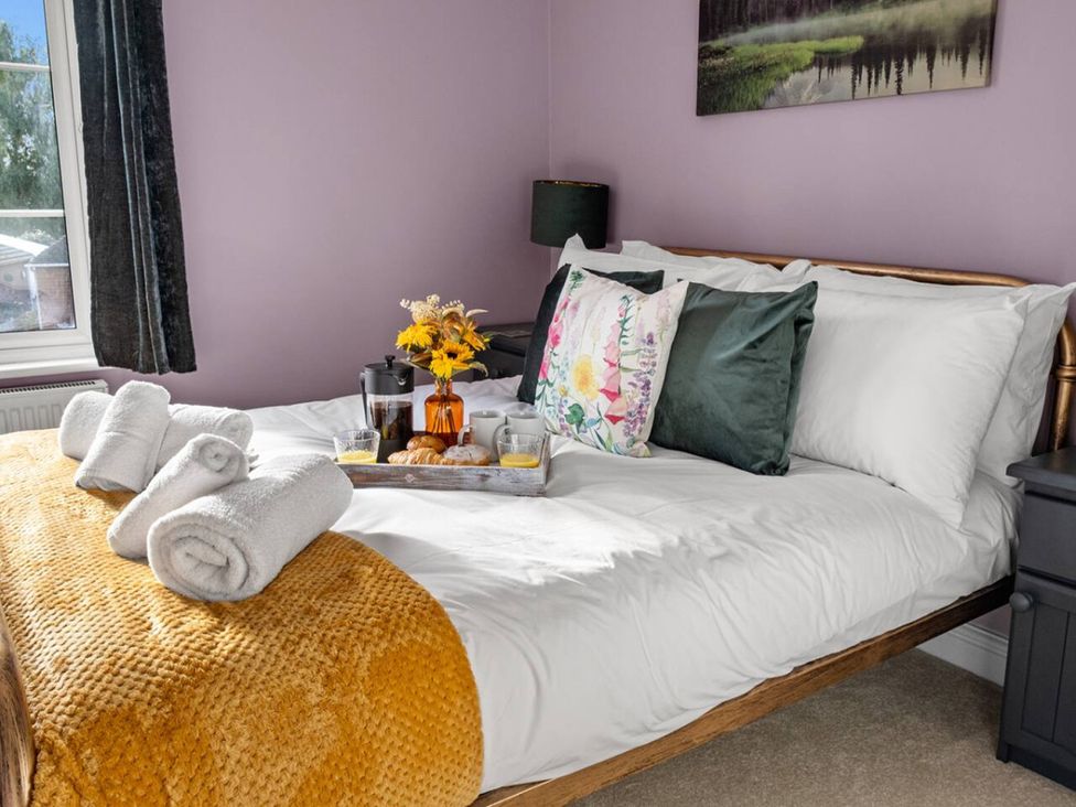 A bedroom with a bed and breakfast tray at a property in location