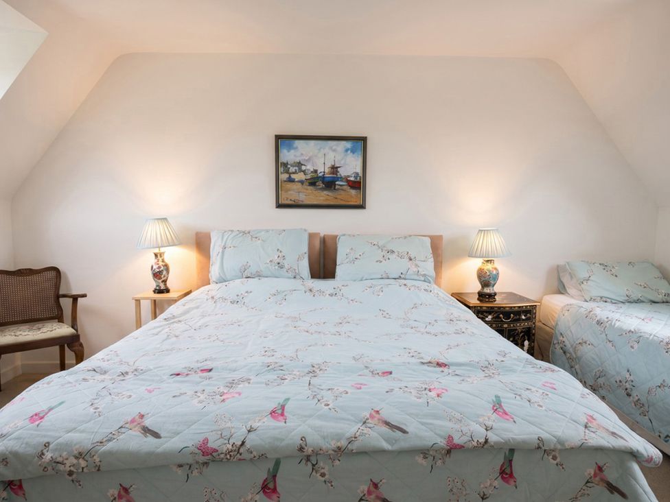 A bedroom with a bed and a lamp at 