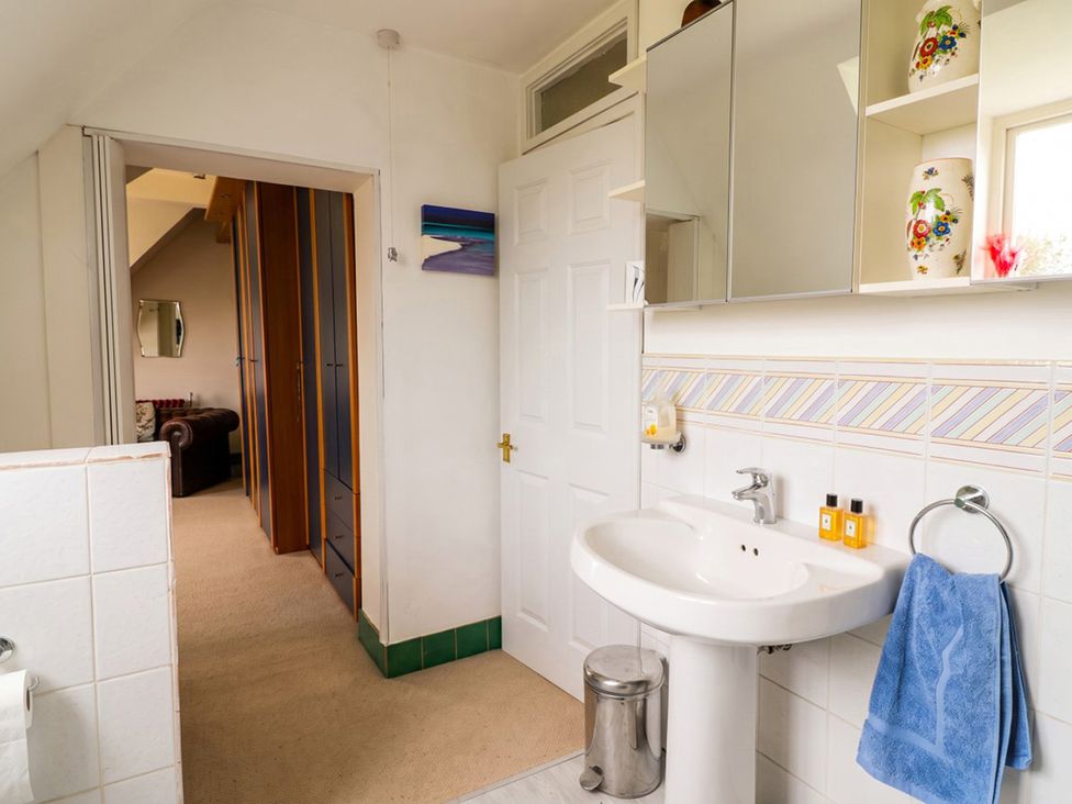 A bathroom with a sink and mirror at The Old Barn in Manchester