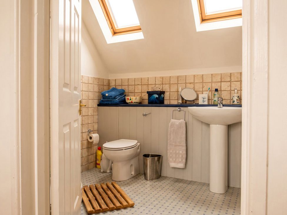 A bathroom with a toilet and sink at The Old Barn in Manchester