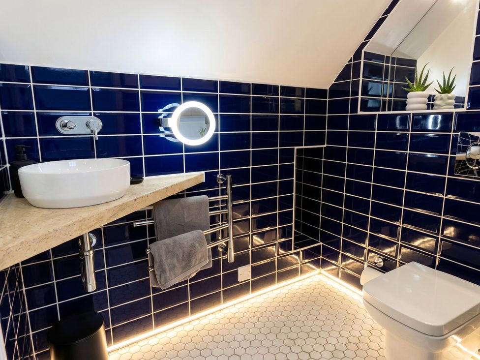 A bathroom with sink and toilet at Emery Street Lodge