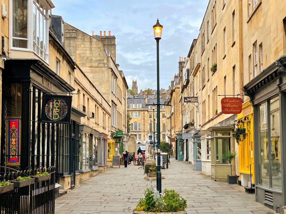 An outdoor street with buildings and cafes at Circus Mews Townhouse in 