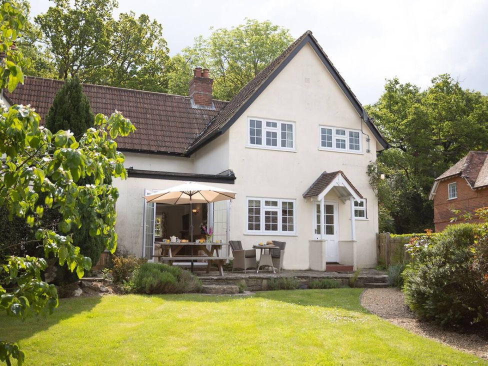 A house with a garden and outdoor furniture at The Old Barn in Manchester