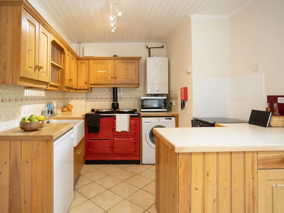 A kitchen with cabinets, countertops, and appliances at The Old Barn in Manchester
