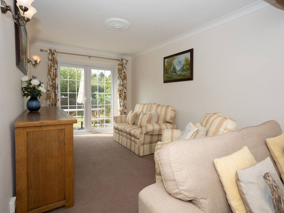 A living room with two sofas and a coffee table at The Old Barn in Manchester