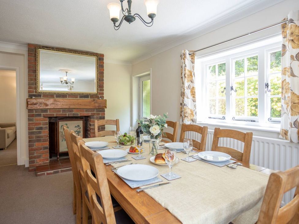 A dining room with a table set for a meal at The Old Barn in Manchester