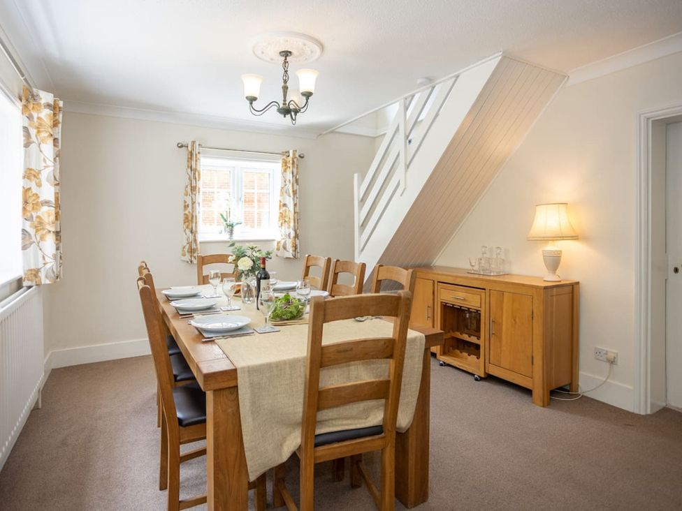 A dining room with a table set for meals at The Old Barn in Manchester