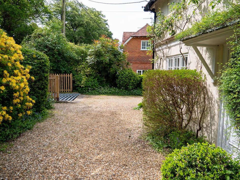 A garden with gravel pathway and greenery at the property
