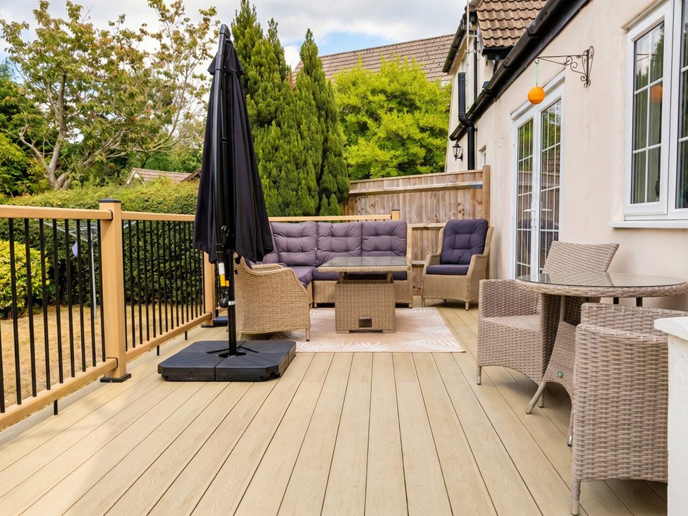 An outdoor seating area with a sofa and coffee table at the property