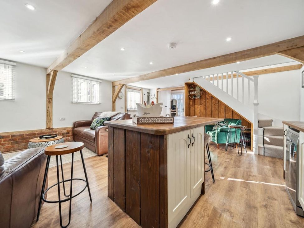 A living room with a sofa and kitchen island at 