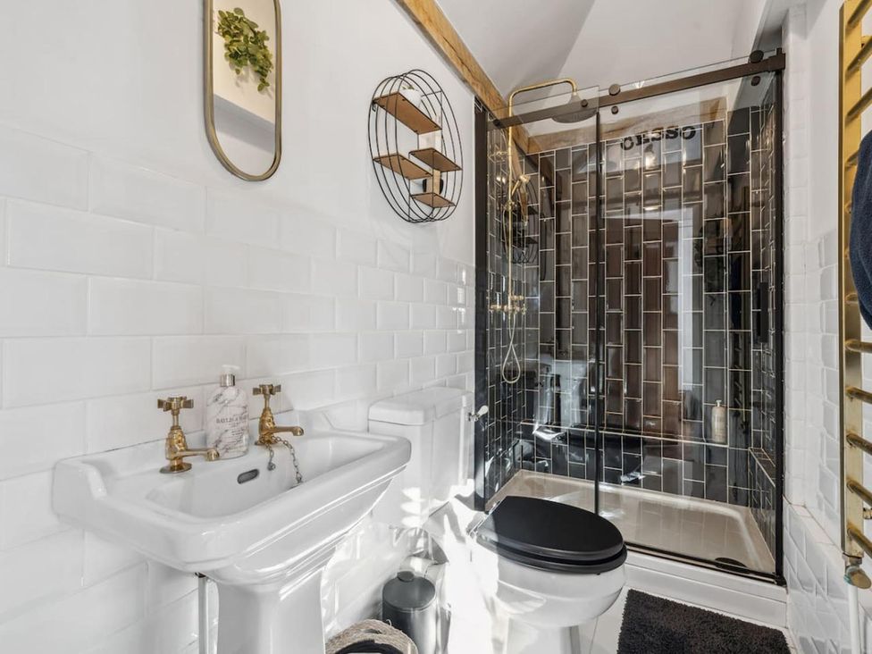 A bathroom featuring a sink, toilet, and shower at an unspecified location