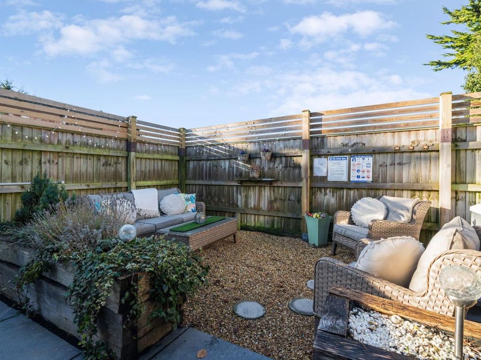 A garden with seating area and decorative elements at the property