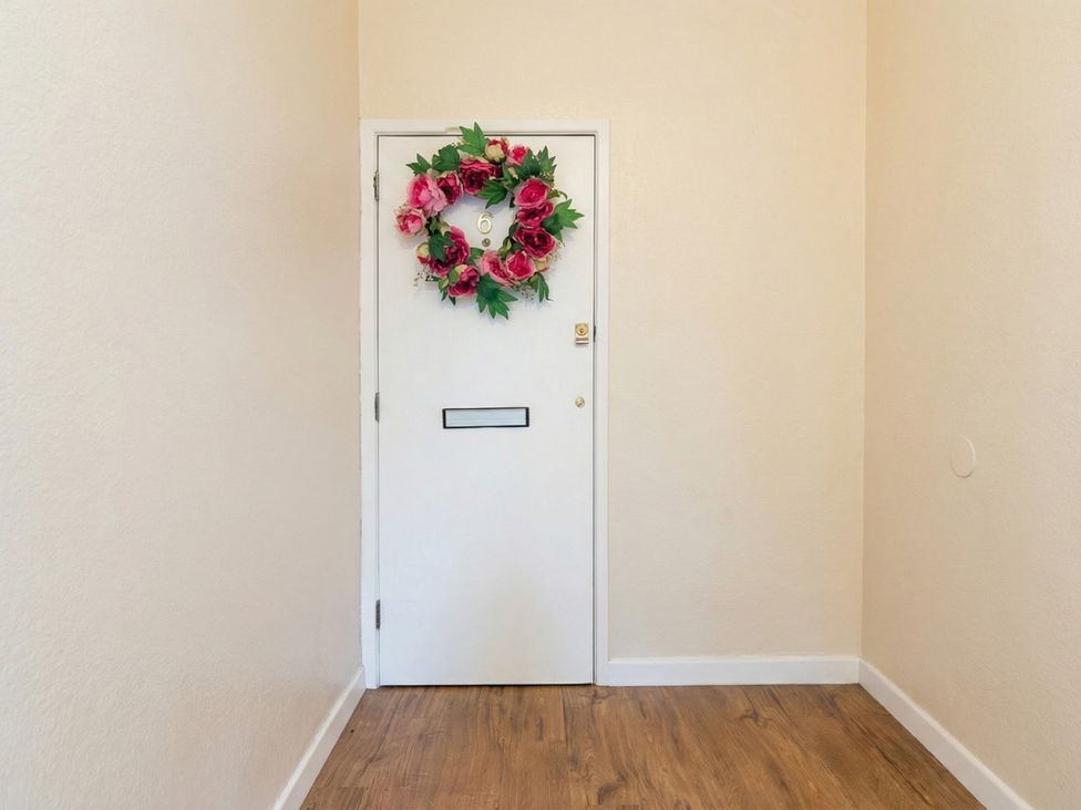 An entryway with a door and wreath at The Old Barn in Manchester