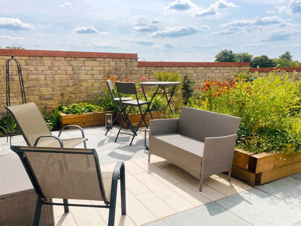 A garden with seating and a table at 