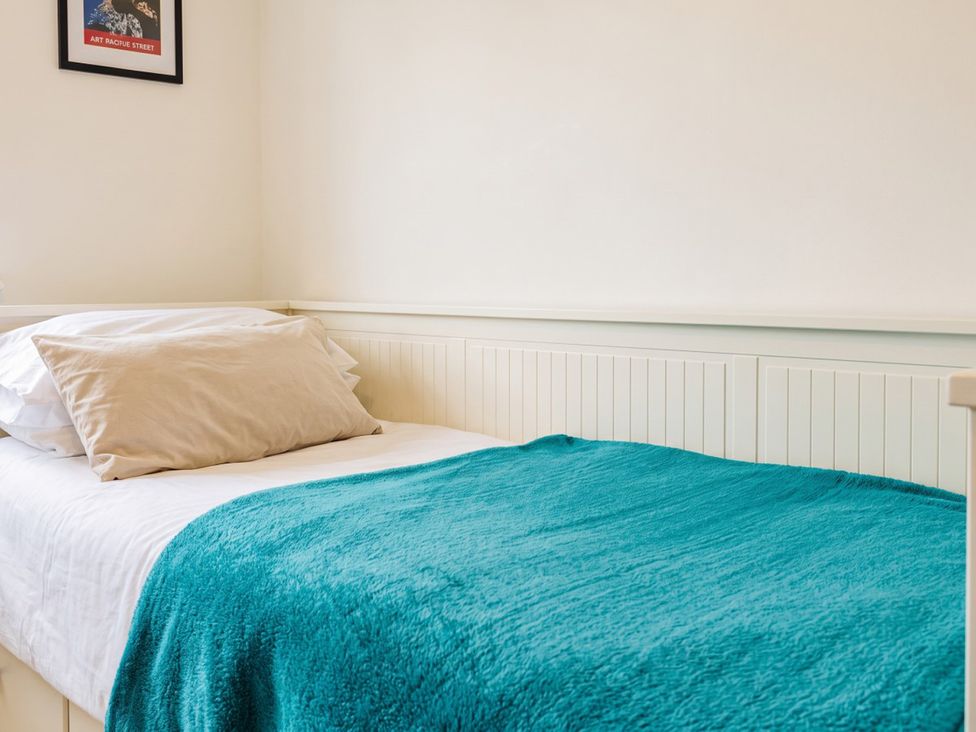 A bed with pillows and a blanket in a bedroom at 