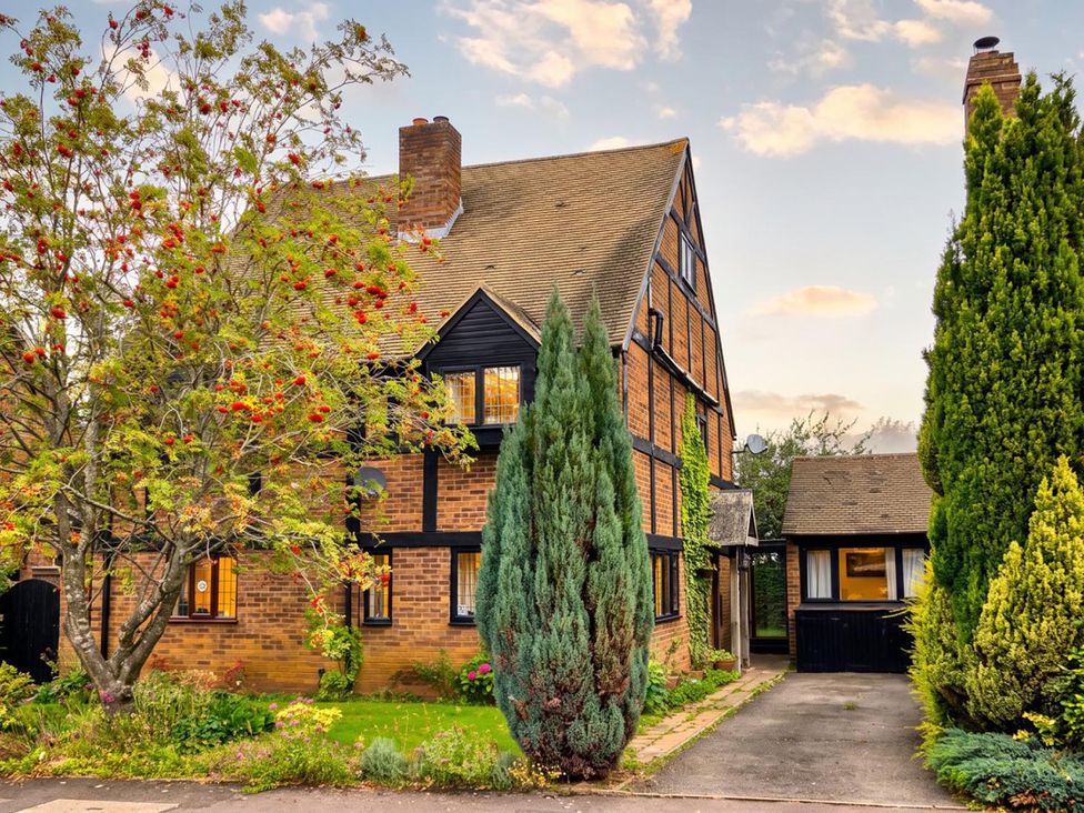 A house with trees and pathway at the property location