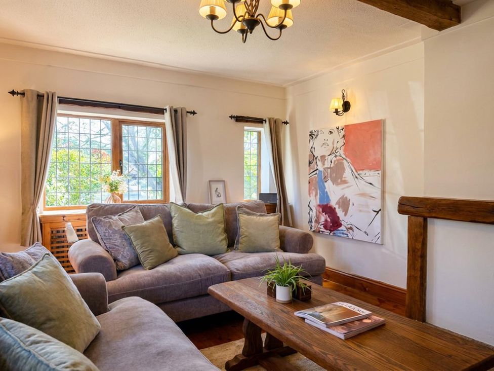 A living room with a sofa and coffee table at The Old Barn in Manchester