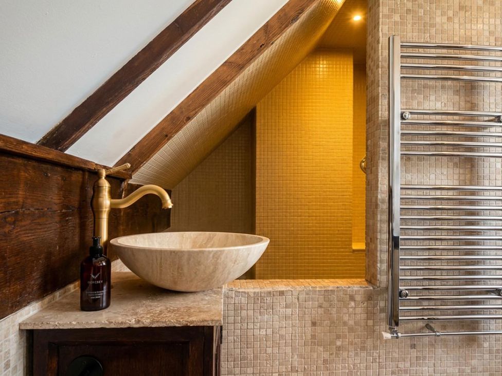 A bathroom with sink and shower at The Old Barn in Manchester