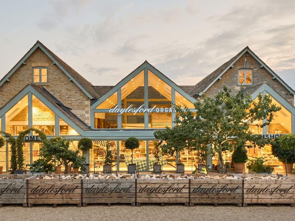 A building with large windows and signage at Daylesford Organic