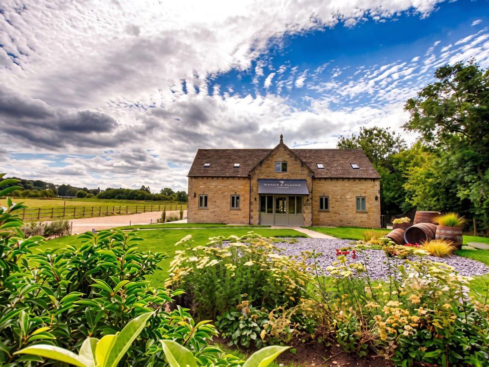 A house with a garden and pathway at a property location