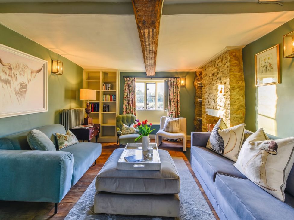 A living room with sofas and a coffee table at The Old Barn in Manchester
