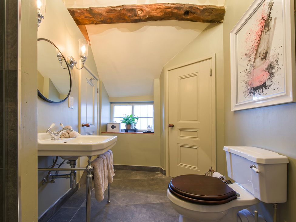 A bathroom with sink and toilet at The Old Barn in Manchester