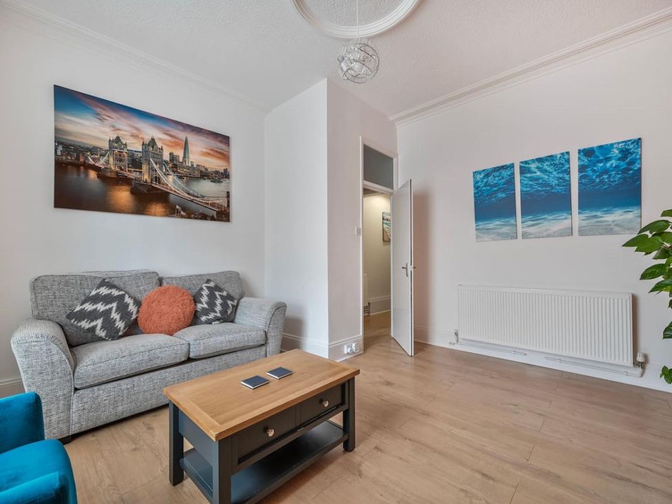 A living room with a sofa and coffee table at The Old Barn in Manchester