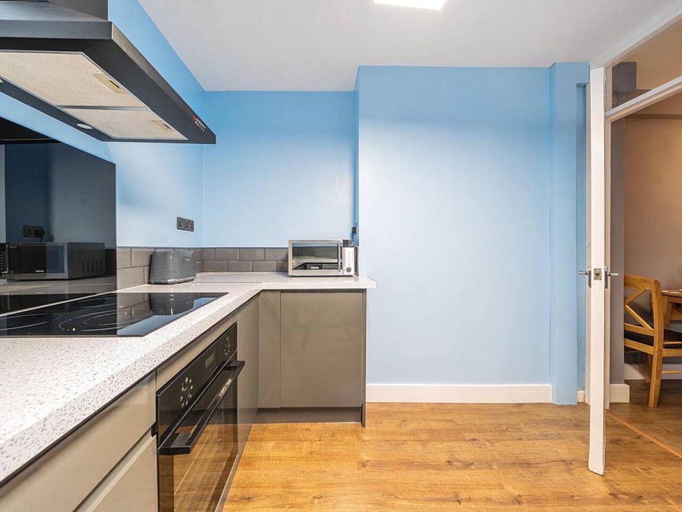 A kitchen with appliances and countertop at The Old Barn in Manchester