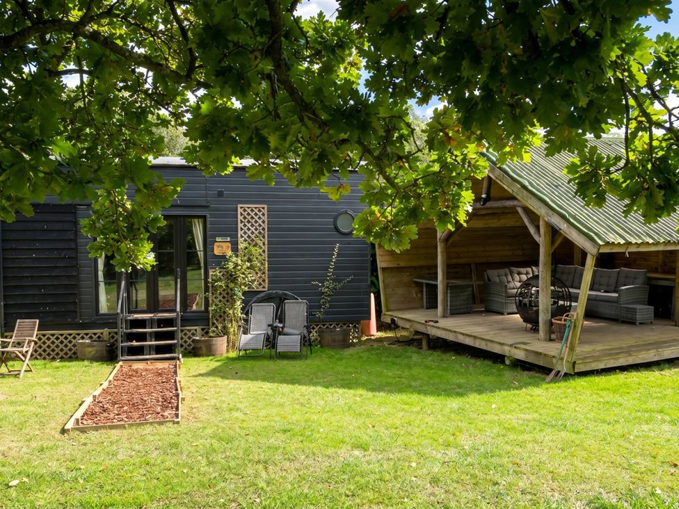 An outdoor area with a staircase and deck at a property