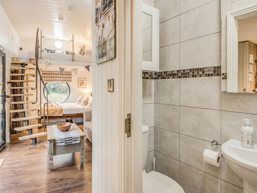 A bathroom with toilet and sink at The Old Barn in Manchester