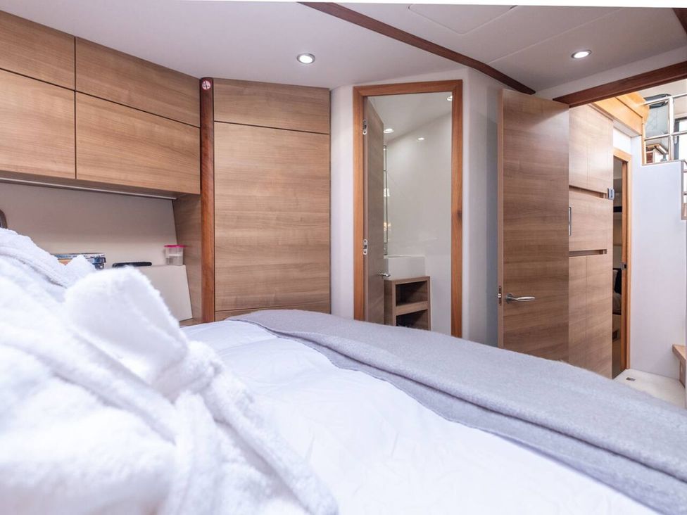 A bedroom with a bed and door at the property in an unspecified location