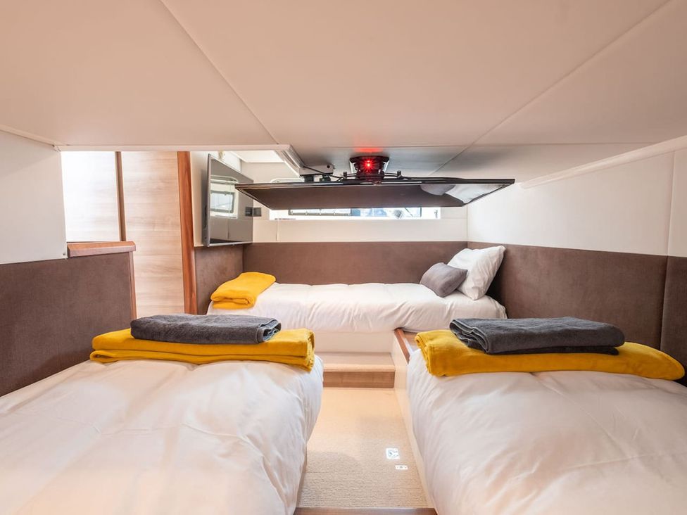 A bedroom with two beds and storage at a property in 