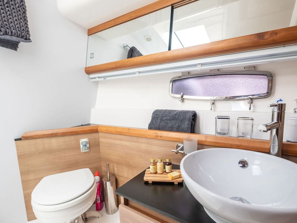 A bathroom with a sink and toilet at 