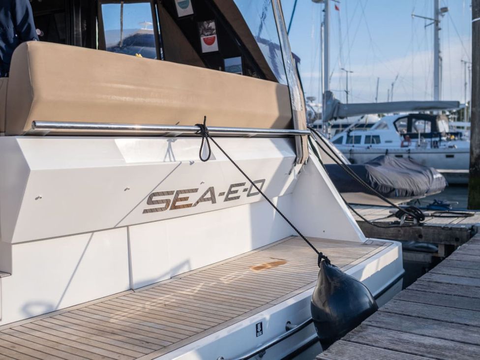 A boat at a dock with the name SEA-E-Z on the side