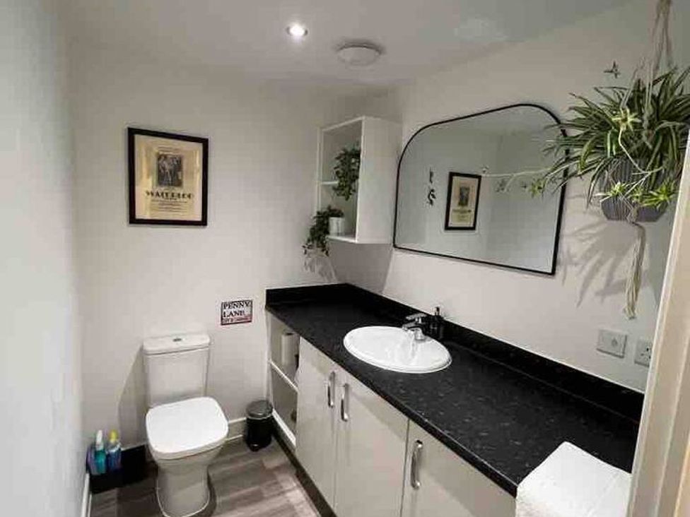 A bathroom with a sink and toilet at 
