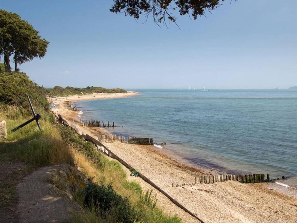 A beach with sand and water at an outdoor location