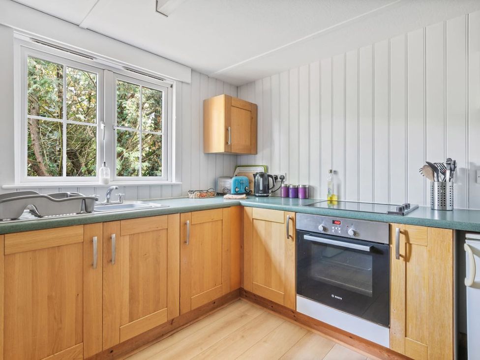 A kitchen with cabinets and appliances at The Hideaway 